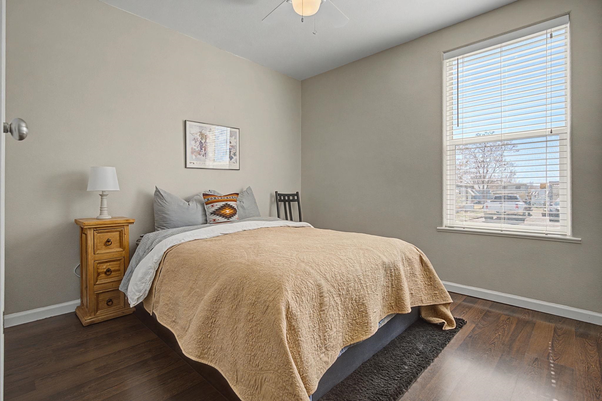 3251 E Road, Unit 72 Clifton, CO 81520 - Photo 20 of 25 a bedroom with a bed and a window