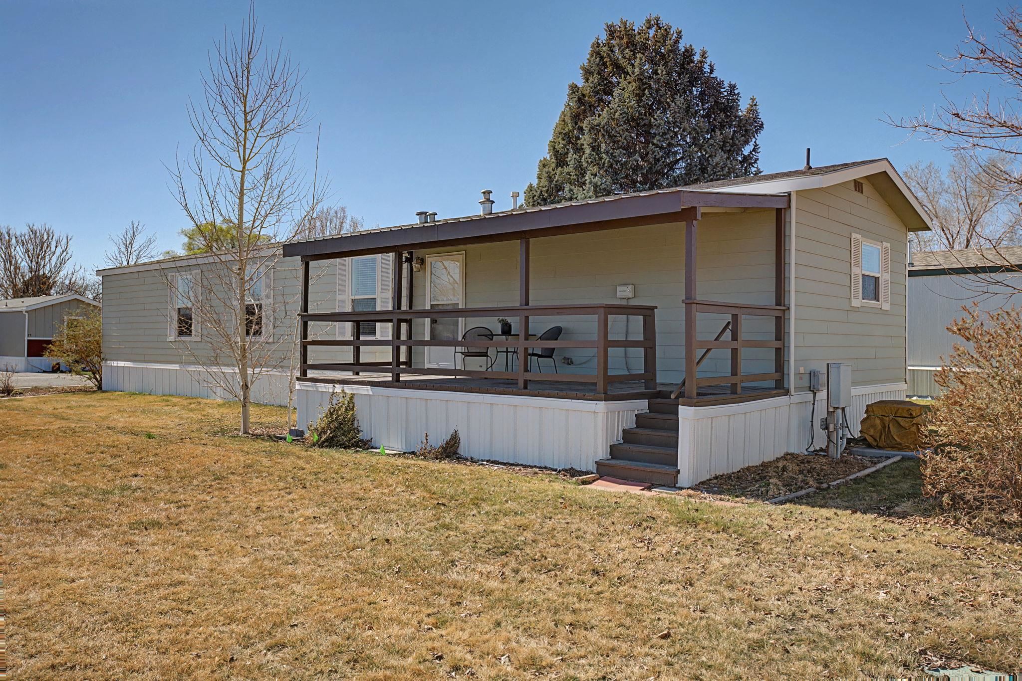 3251 E Road, Unit 72 Clifton, CO 81520 - Photo 24 of 25 a view of a house with a yard