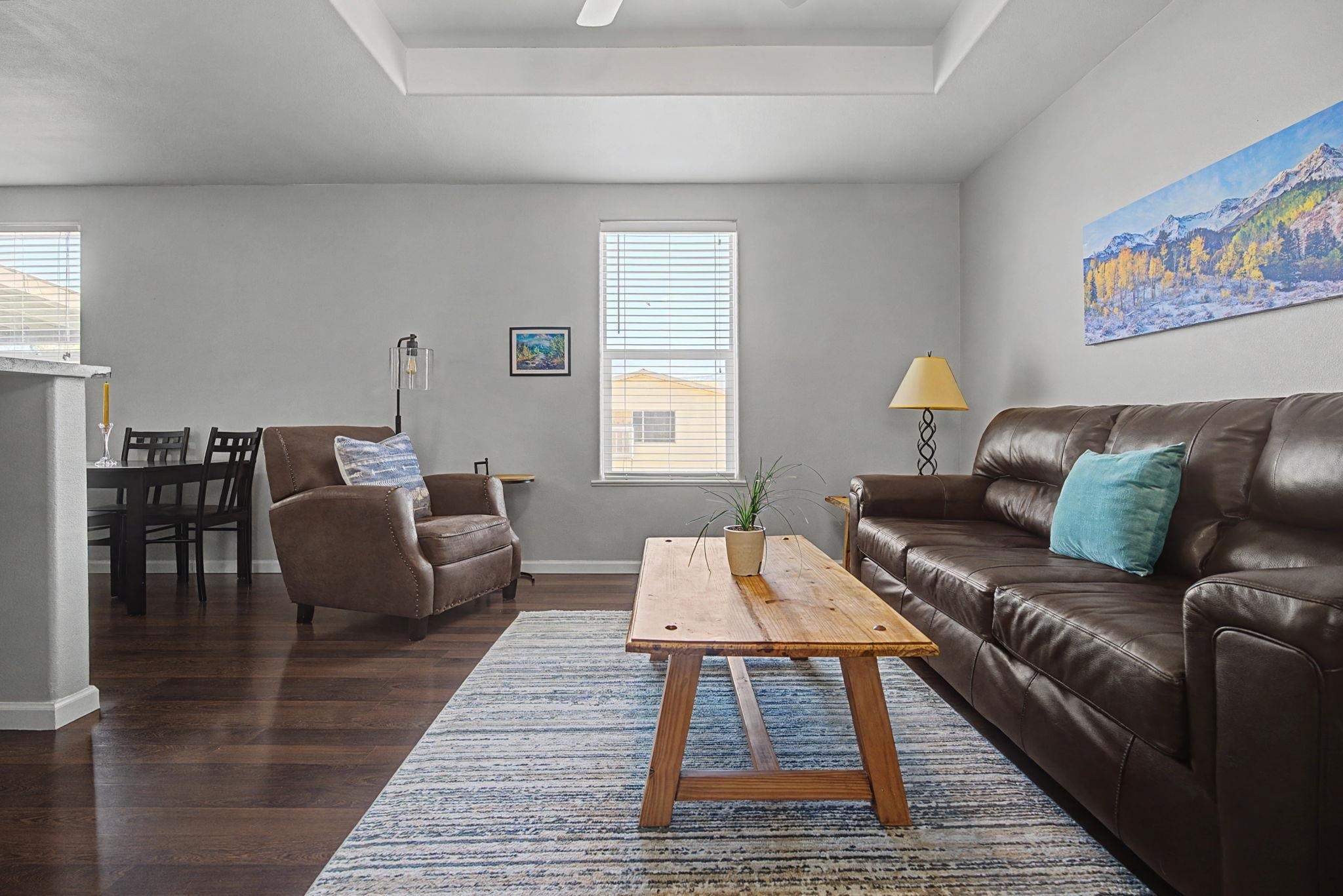 3251 E Road, Unit 72 Clifton, CO 81520 - Photo 6 of 25 a living room with furniture and wooden floor