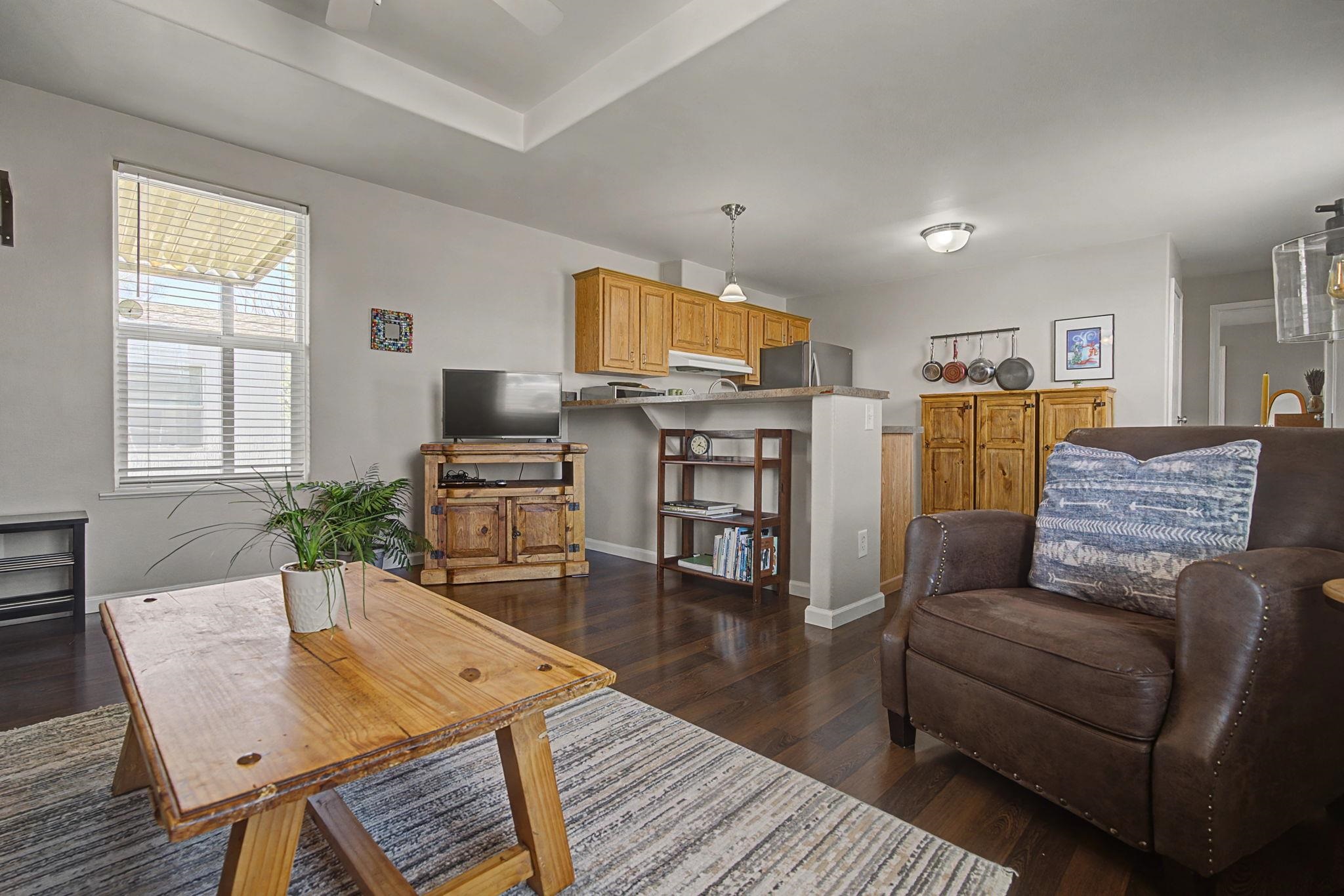 3251 E Road, Unit 72 Clifton, CO 81520 - Photo 7 of 25 a living room with furniture and wooden floor