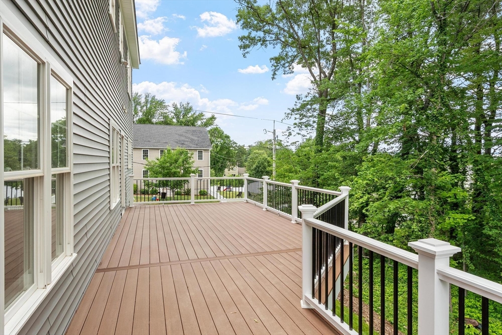 37 Dogwood Road Littleton, MA 01460 - Photo 20 of 36 a view of balcony with wooden floor and fence