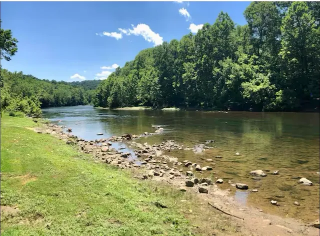a view of a lake with a big yard