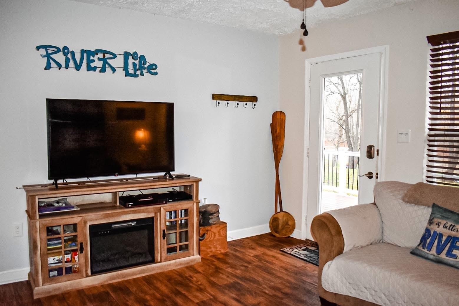 4551 Grove Hill River Road Shenandoah, VA 22849 - Photo 13 of 41 a living room with furniture and a flat screen tv