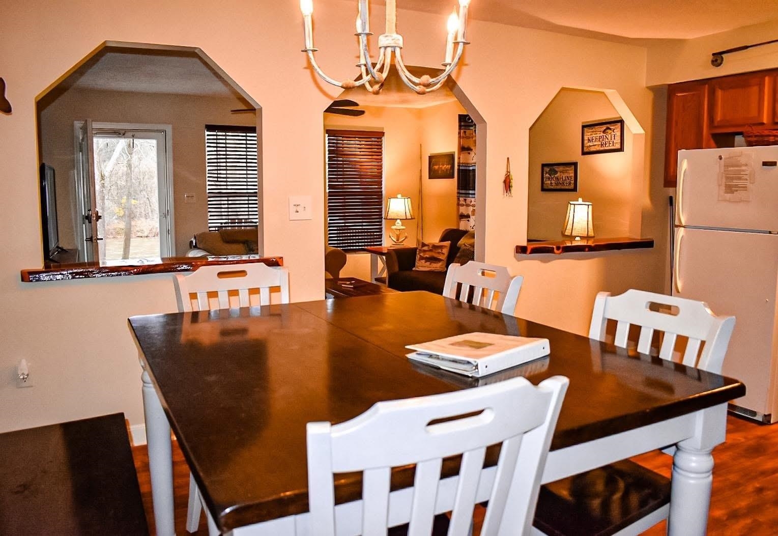 4551 Grove Hill River Road Shenandoah, VA 22849 - Photo 16 of 41 a view of a dining room with furniture and chandelier