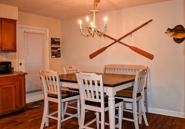 a dining room with furniture and wooden floor