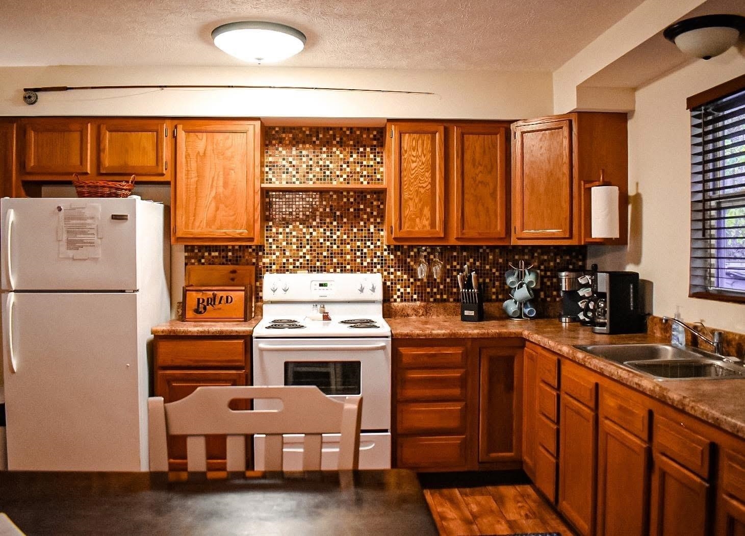 4551 Grove Hill River Road Shenandoah, VA 22849 - Photo 20 of 41 a kitchen with a stove a sink and a refrigerator
