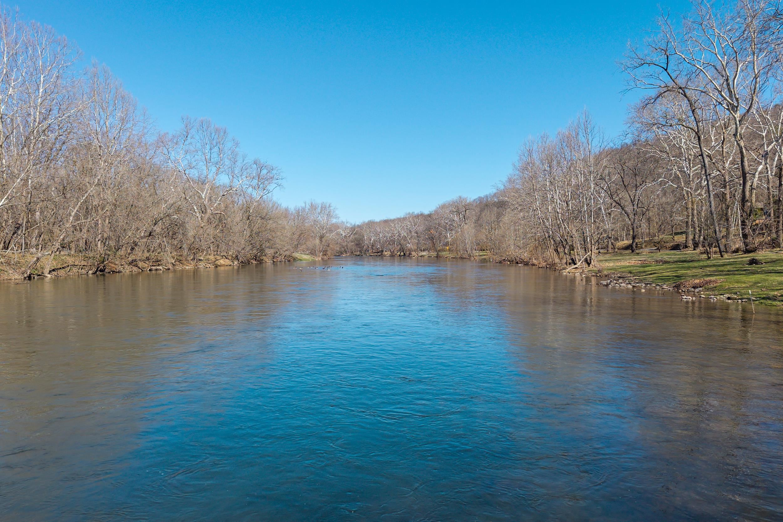 4551 Grove Hill River Road Shenandoah, VA 22849 - Photo 35 of 41 a view of a lake with a building in the background