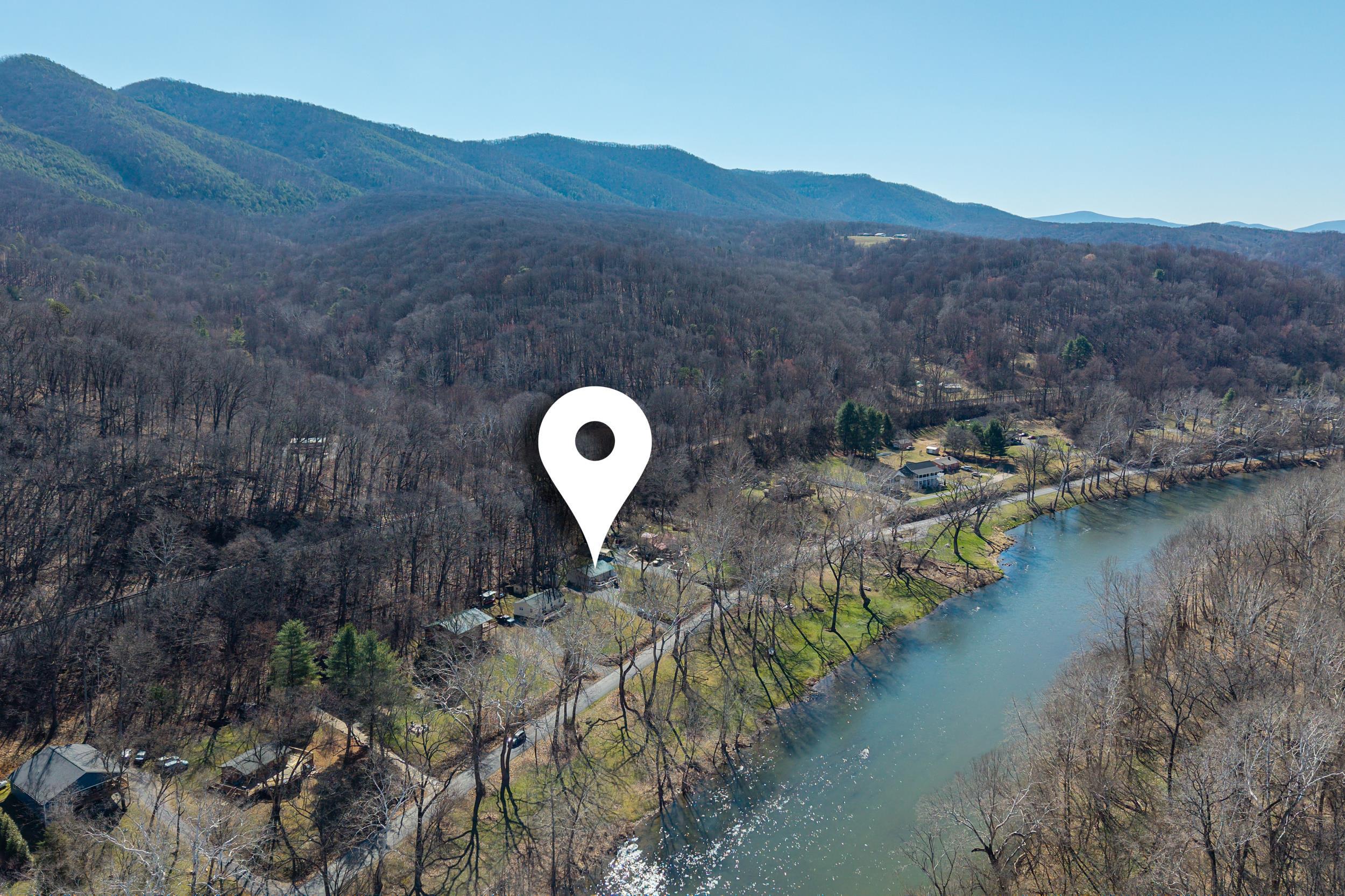 4551 Grove Hill River Road Shenandoah, VA 22849 - Photo 37 of 41 a view of a lake with a mountain