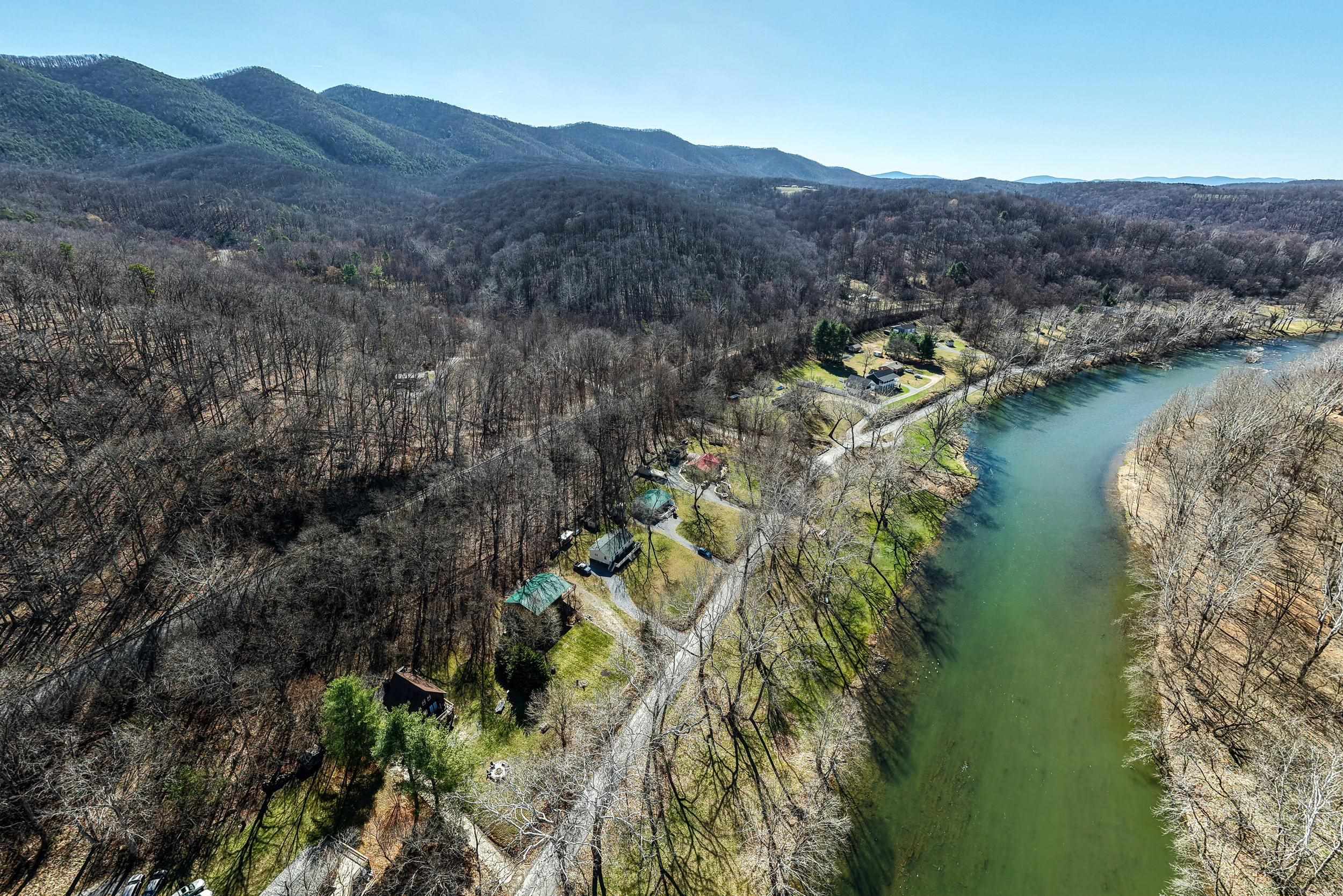 4551 Grove Hill River Road Shenandoah, VA 22849 - Photo 40 of 41 a view of a lake with mountains in the background