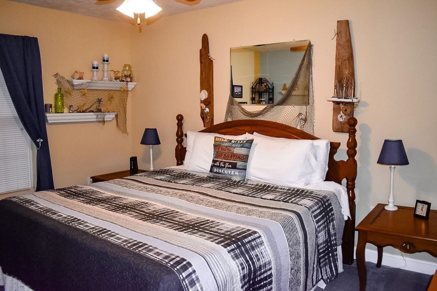 4551 Grove Hill River Road Shenandoah, VA 22849 - Photo 8 of 41 a bedroom with a bed and a chandelier