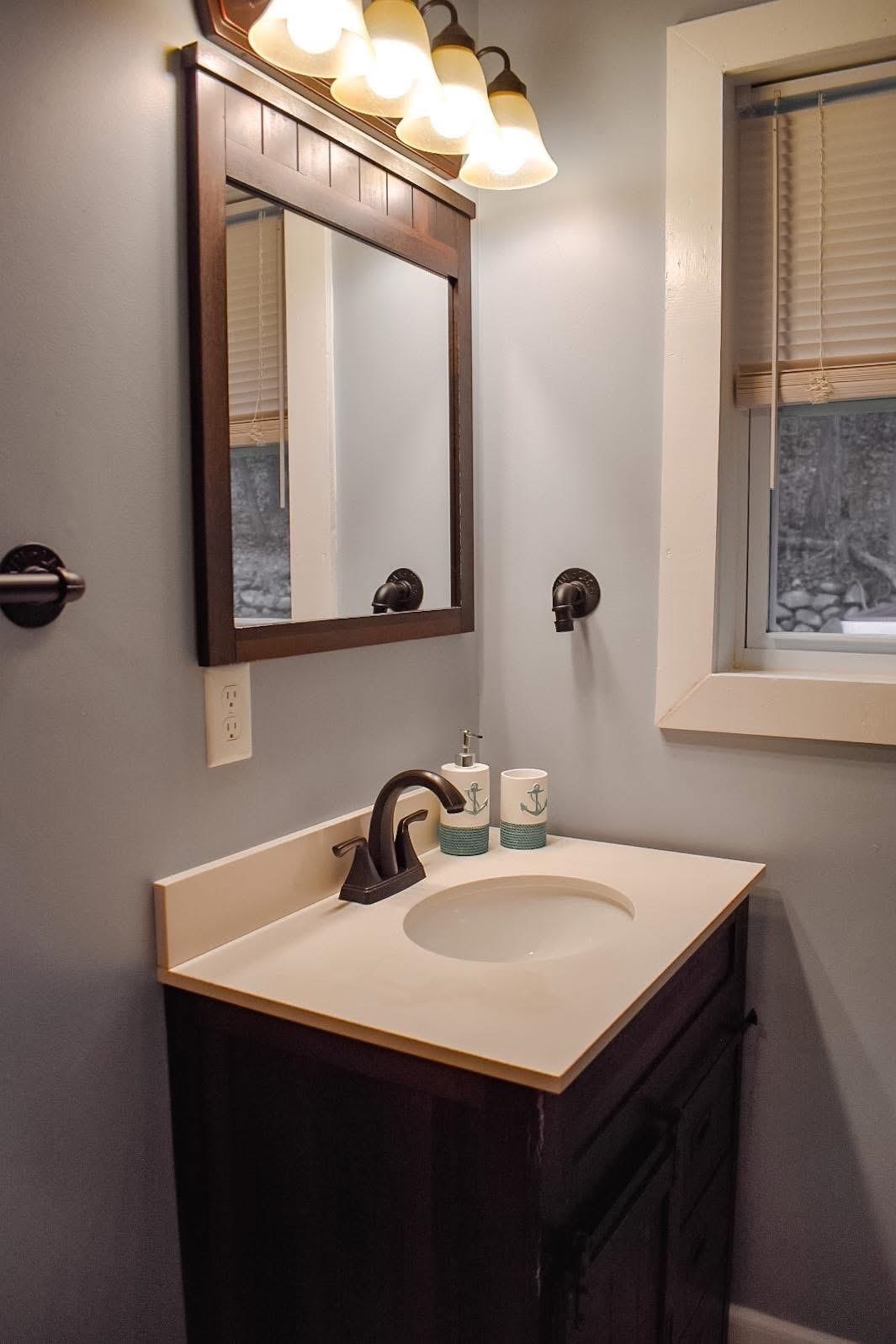 4551 Grove Hill River Road Shenandoah, VA 22849 - Photo 10 of 41 a bathroom with a sink vanity and a mirror