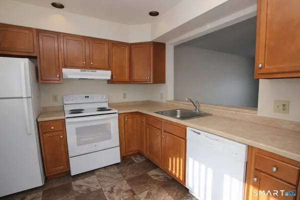 a view of kitchen with furniture and wooden floor