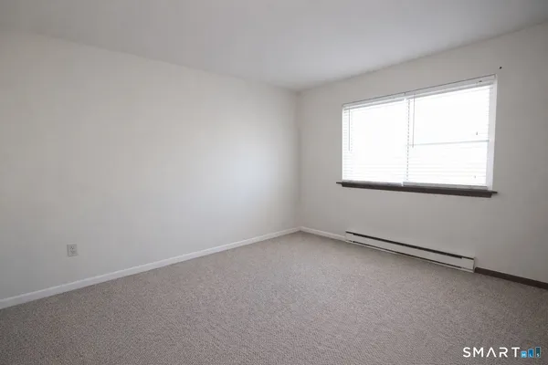 a workspace with furniture and a window