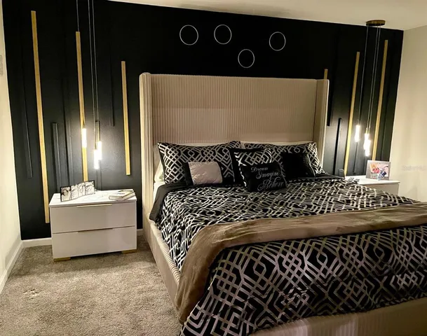 a bedroom with a bed and window