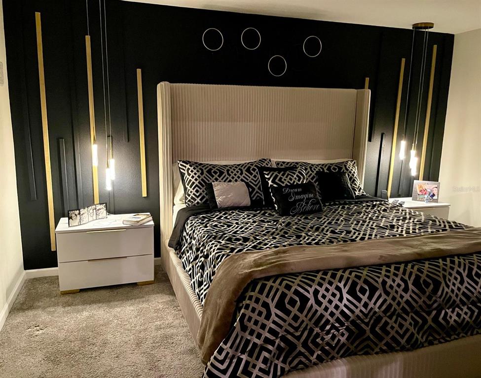 279 Bergamot Loop Davenport, FL 33837 - Photo 11 of 38 a bedroom with a bed and window