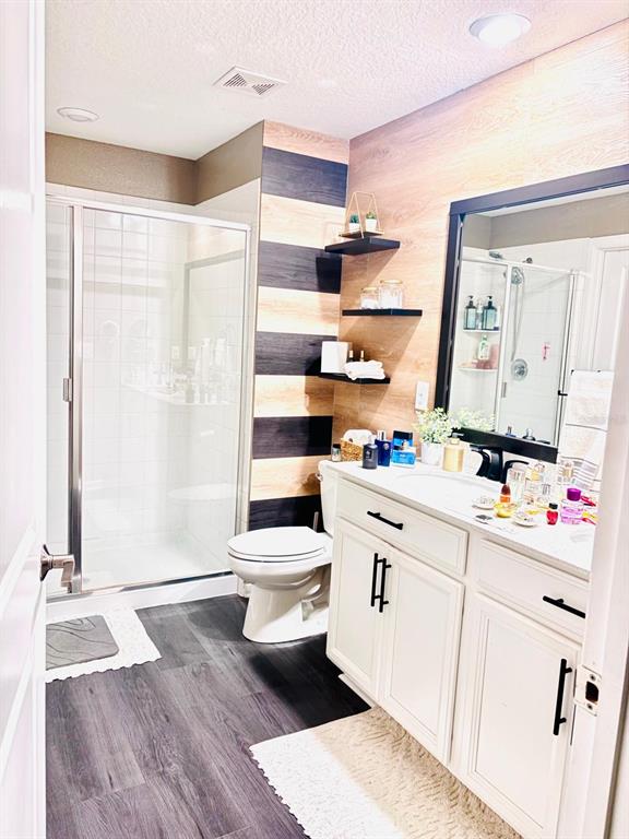 279 Bergamot Loop Davenport, FL 33837 - Photo 12 of 38 a bathroom with a sink mirror and a toilet