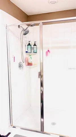 a bathroom with a shower and a shower curtain