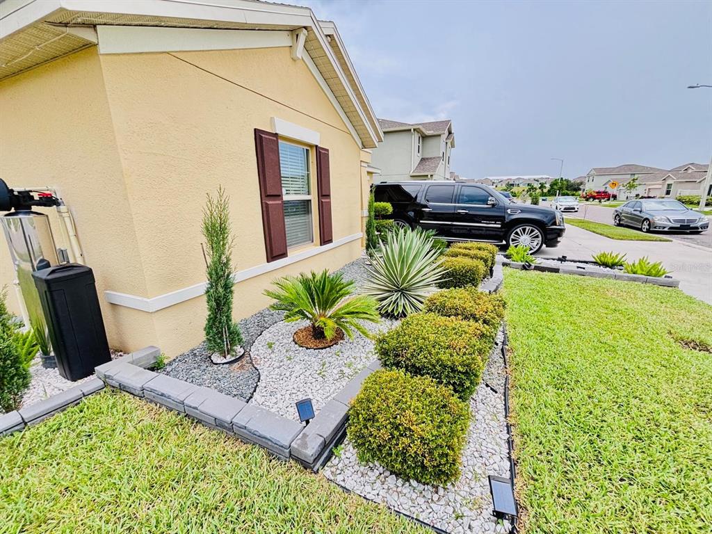 279 Bergamot Loop Davenport, FL 33837 - Photo 2 of 38 a living room with furniture and a table