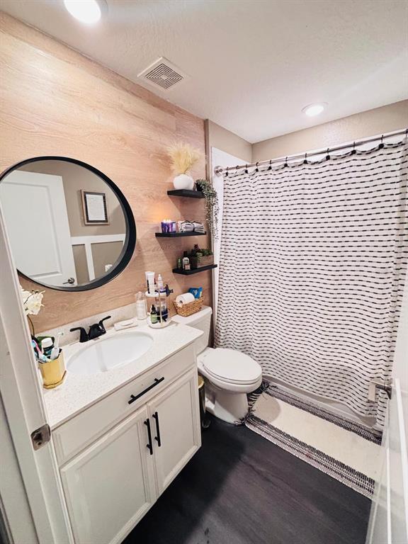 279 Bergamot Loop Davenport, FL 33837 - Photo 23 of 38 a bathroom with a sink a toilet and a mirror