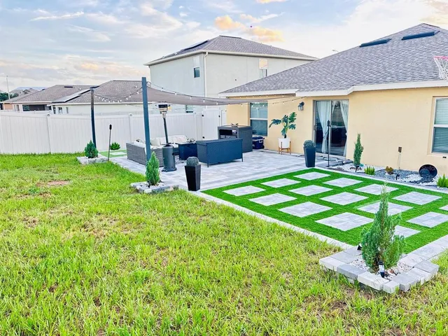 a building outdoor space with patio lots of furniture