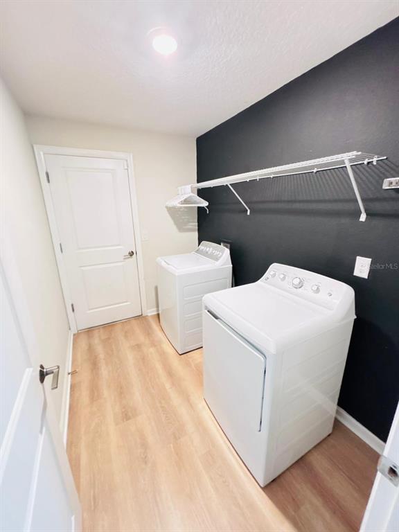 279 Bergamot Loop Davenport, FL 33837 - Photo 36 of 38 a utility room with dryer and washer