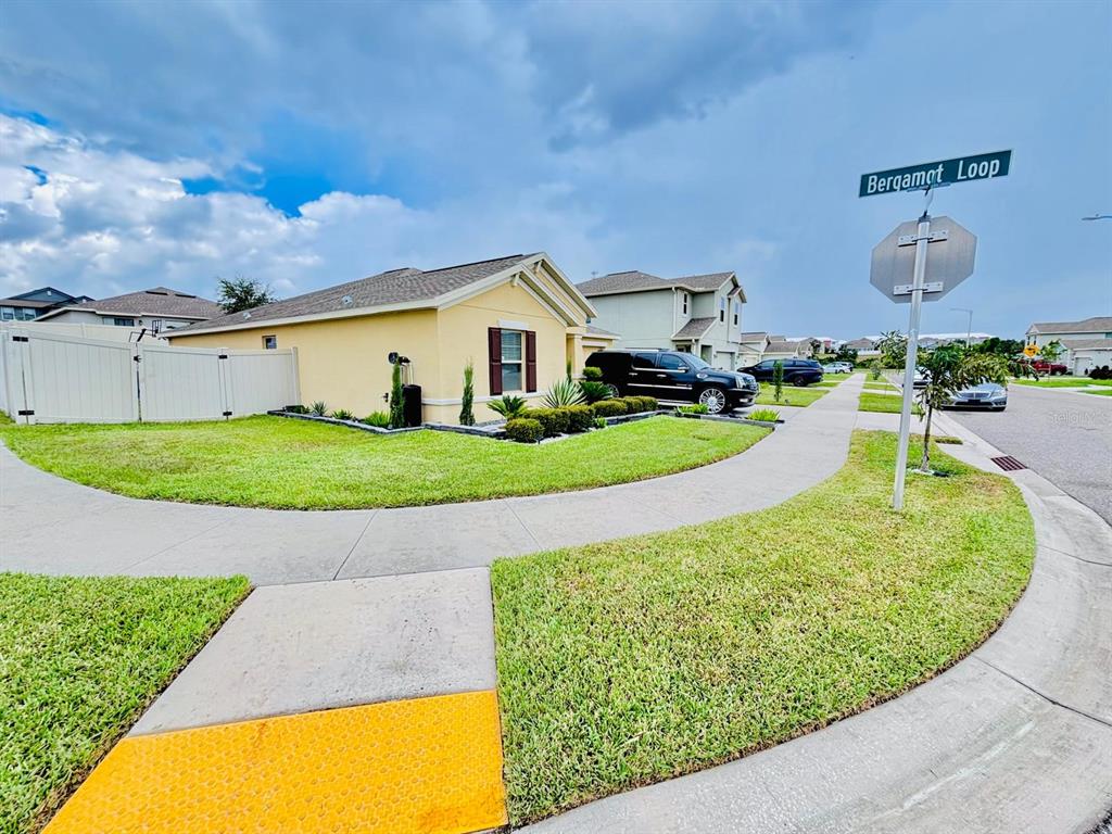 279 Bergamot Loop Davenport, FL 33837 - Photo 4 of 38 a view of a swimming pool with a patio
