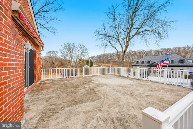 a view of a balcony and iron fence