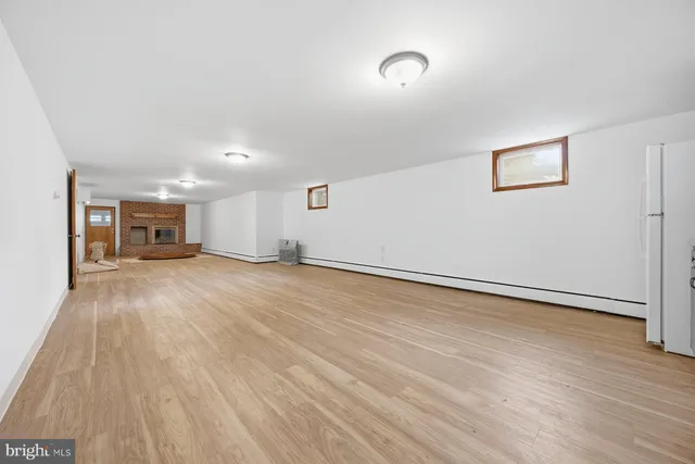 a view of a livingroom with a furniture and wooden floor