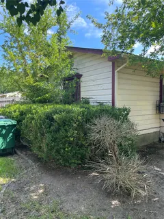 a view of a backyard of the house