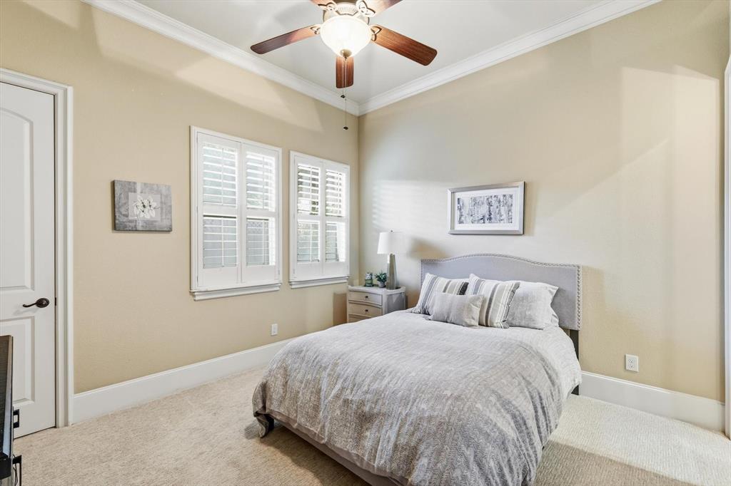 476 Hidden Valley Lane Coppell, TX 75019 - Photo 17 of 40 a bedroom with a bed and a window