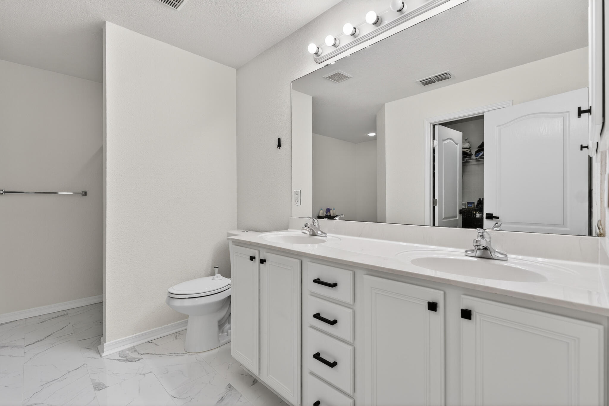 268 Loblolly Bay Drive Santa Rosa Beach, FL 32459 - Photo 41 of 73 a bathroom with a double vanity sink toilet and mirror
