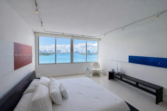 a living room with a rug and a table