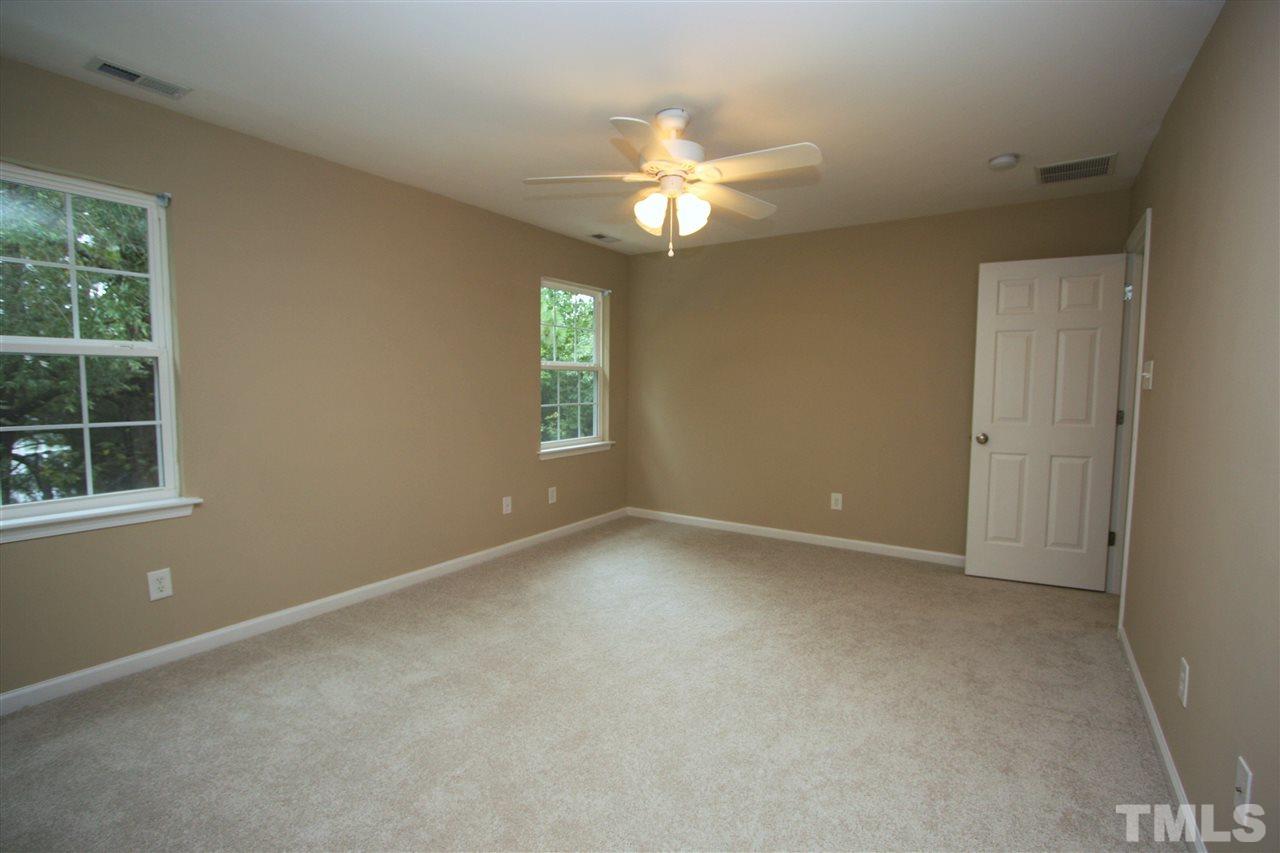 8902 Thornton Garden Lane Raleigh, NC 27616 - Photo 17 of 23 a view of an empty room with a window