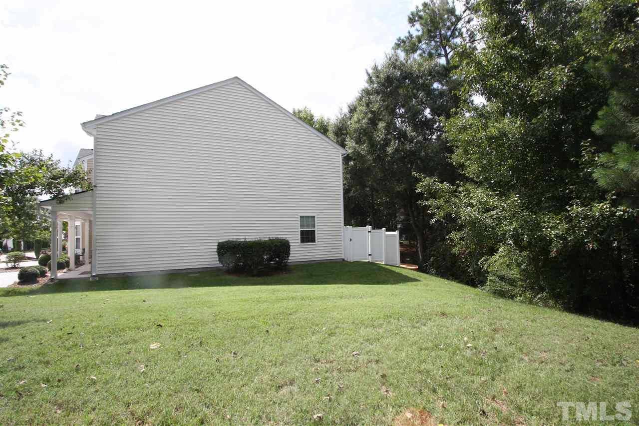8902 Thornton Garden Lane Raleigh, NC 27616 - Photo 7 of 23 a view of a house with a yard and garage