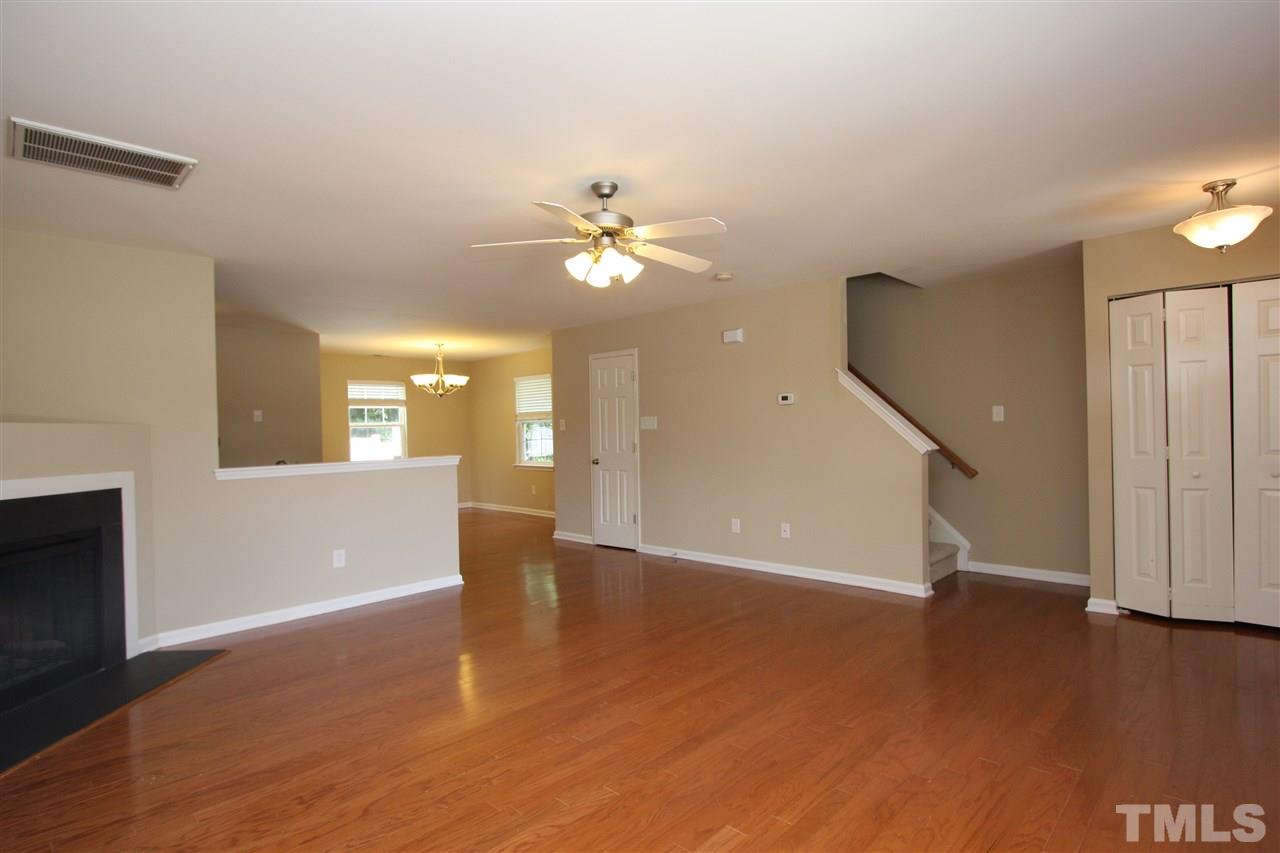 8902 Thornton Garden Lane Raleigh, NC 27616 - Photo 9 of 23 wooden floor in an empty room with a window