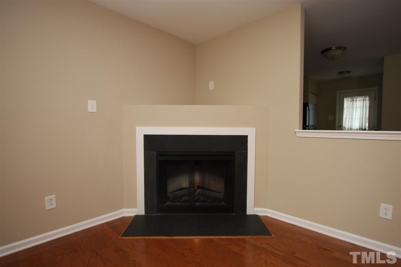 8902 Thornton Garden Lane Raleigh, NC 27616 - Photo 10 of 23 a living room with a fireplace