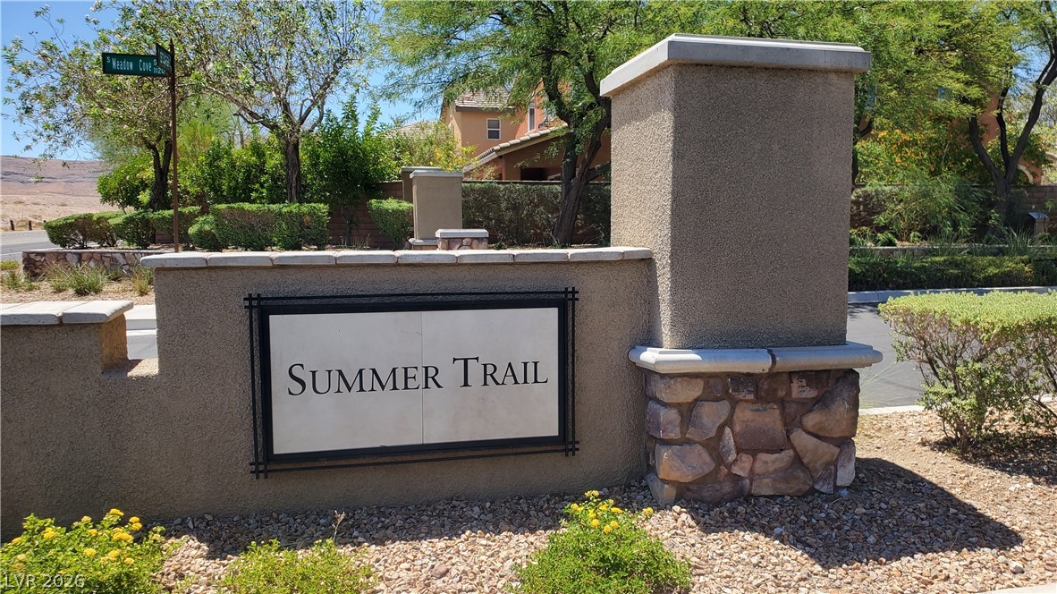 7903 Dell Ridge Avenue Las Vegas, NV 89179 - Photo 19 of 20 Welcoming stone and stucco entry sign marks the start of a pleasant neighborhood.