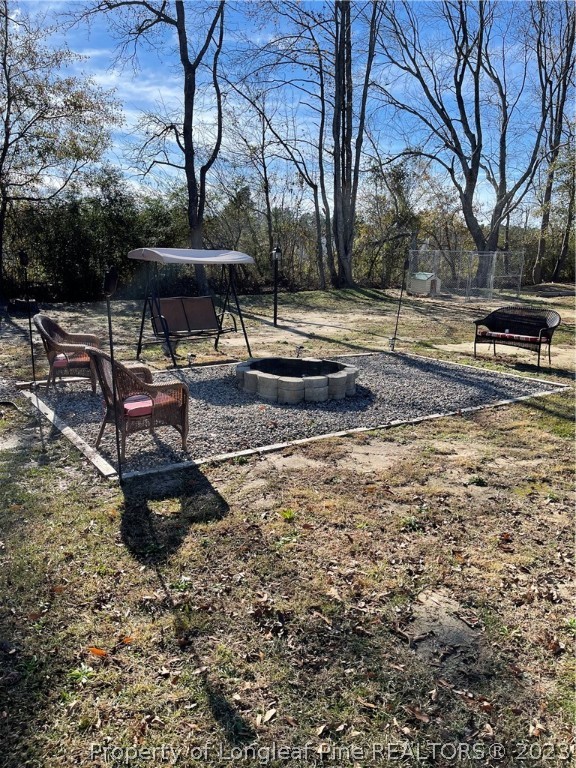 1202 Rowan Road Lumberton, NC 28358 - Photo 3 of 35 a view of a backyard with water fountain