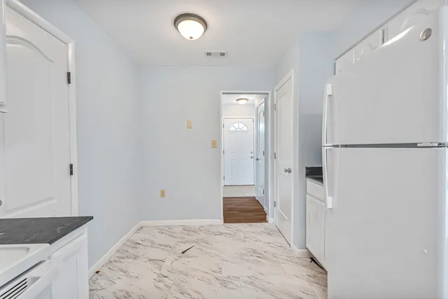 a bathroom with a granite countertop sink