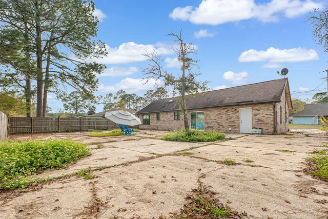 a view of a house with a yard and garage
