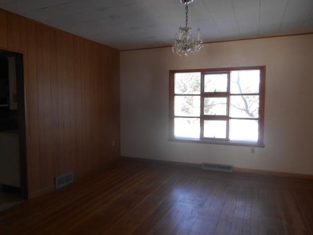 419 North Appleton Road Belvidere, IL 61008 - Photo 5 of 21 an empty room with wooden floor and windows