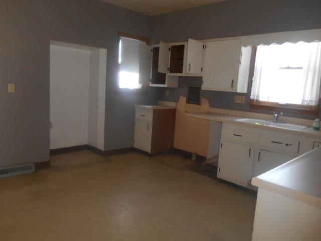 419 North Appleton Road Belvidere, IL 61008 - Photo 6 of 21 a kitchen with a sink cabinets and stainless steel appliances