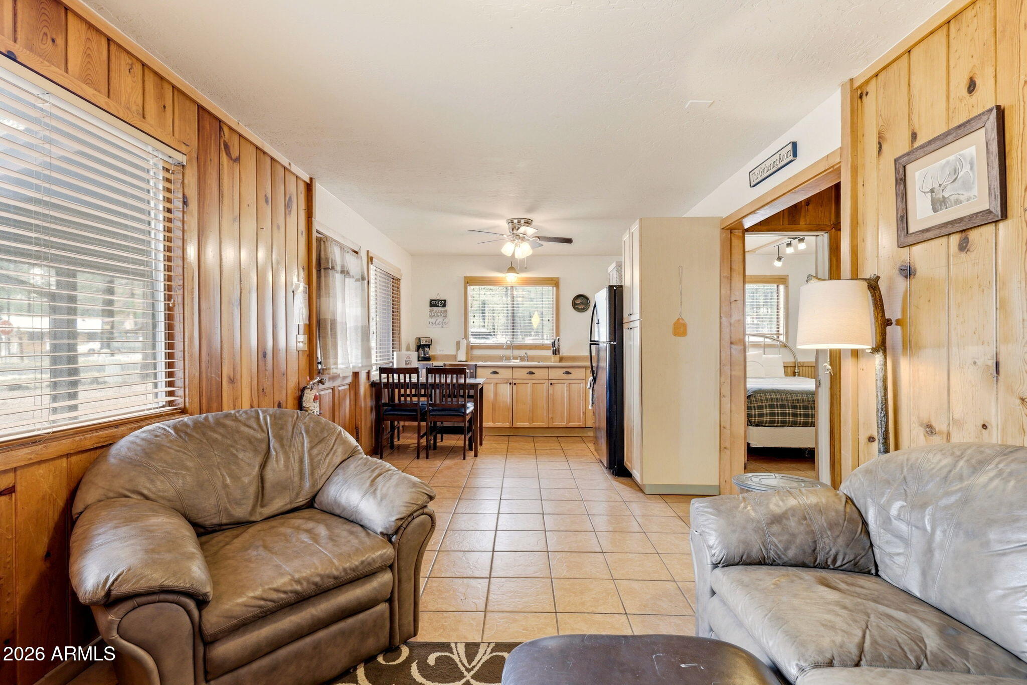 41 Main Street Greer, AZ 85927 - Photo 10 of 30 a living room with furniture and a fireplace