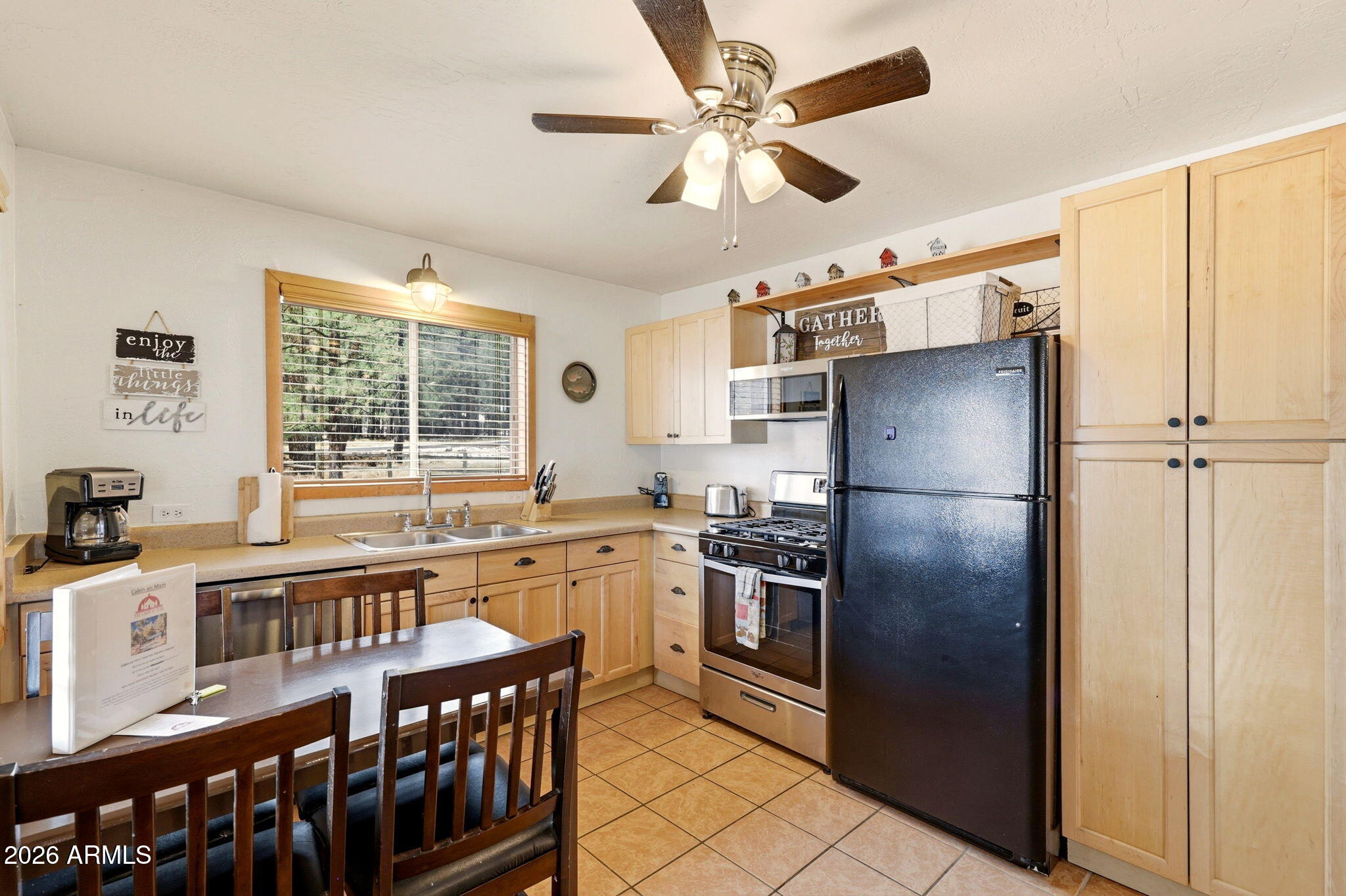 41 Main Street Greer, AZ 85927 - Photo 13 of 30 a kitchen with stainless steel appliances granite countertop a refrigerator a sink a stove and island