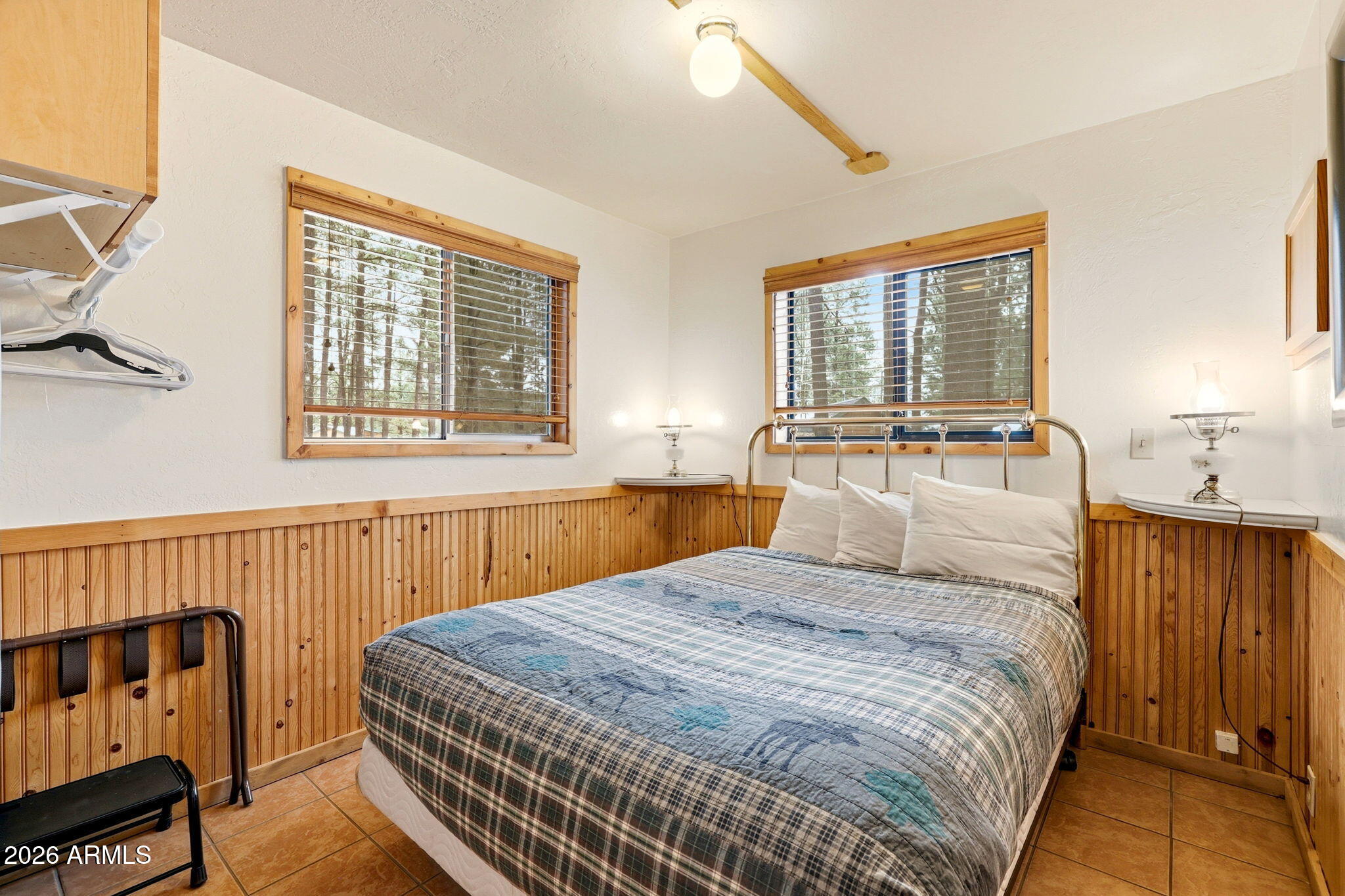 41 Main Street Greer, AZ 85927 - Photo 15 of 30 a bedroom with a bed and window