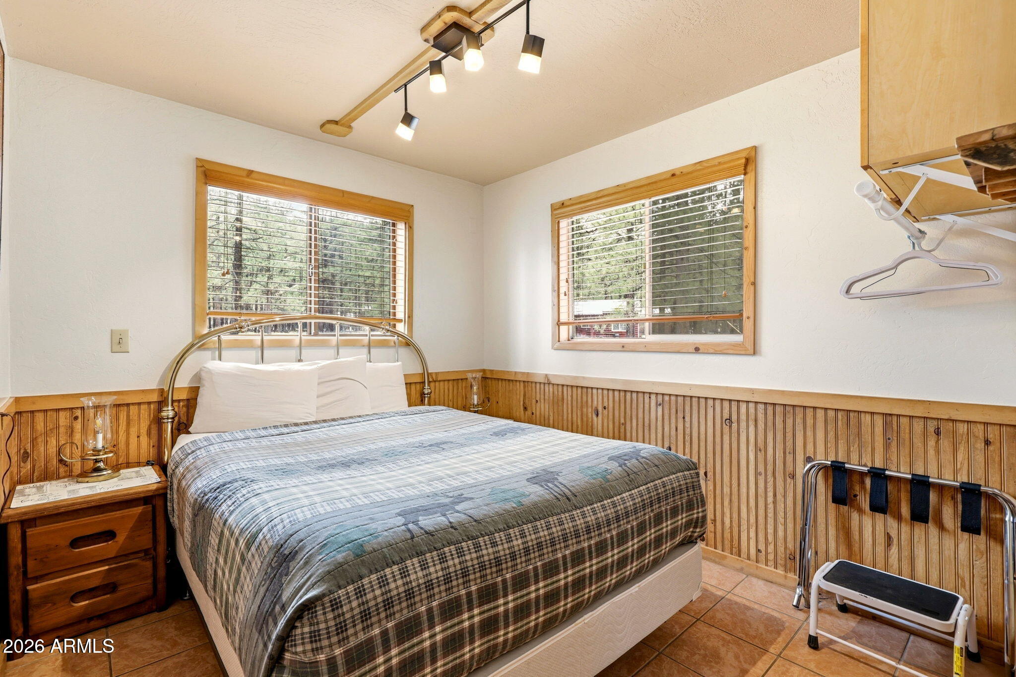 41 Main Street Greer, AZ 85927 - Photo 19 of 30 a bedroom with a bed and a window