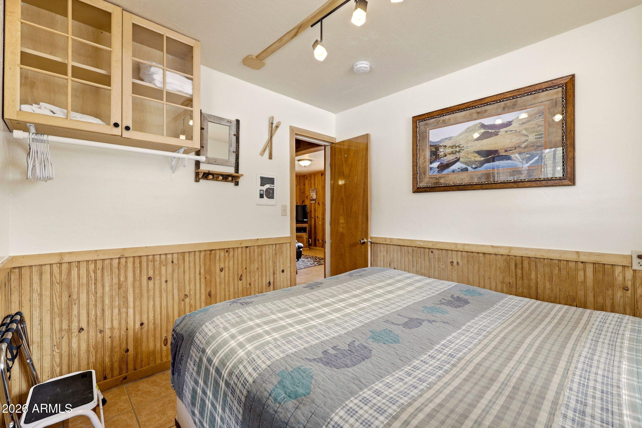41 Main Street Greer, AZ 85927 - Photo 20 of 30 a bedroom with a bed and a painting on the wall