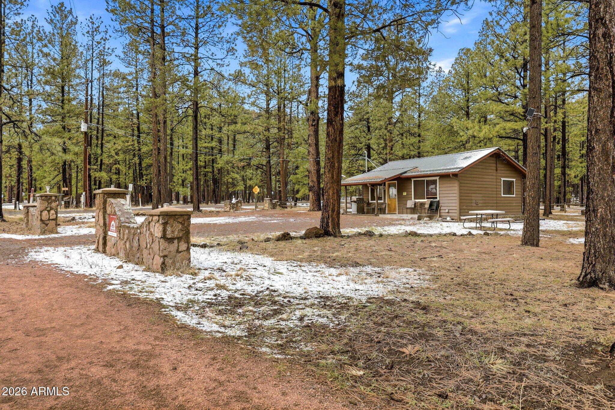 41 Main Street Greer, AZ 85927 - Photo 4 of 30 a house with trees in the background