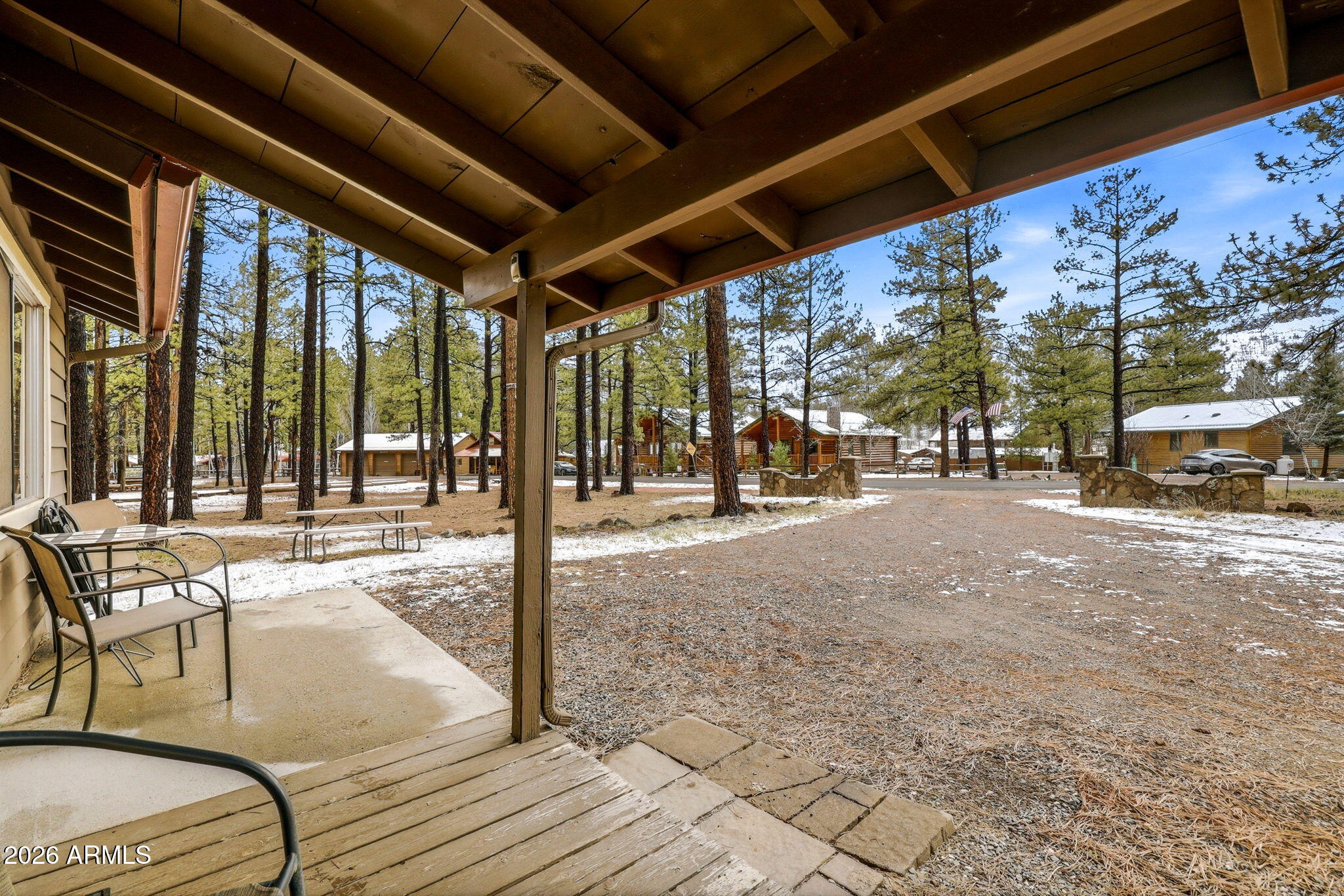 41 Main Street Greer, AZ 85927 - Photo 6 of 30 a view of a patio with a table and chairs