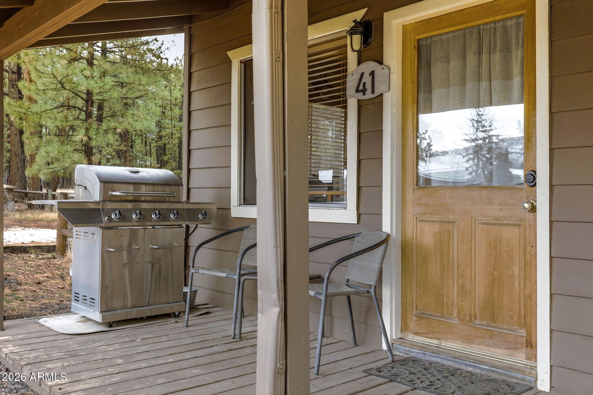 41 Main Street Greer, AZ 85927 - Photo 7 of 30 a view of a balcony with chairs